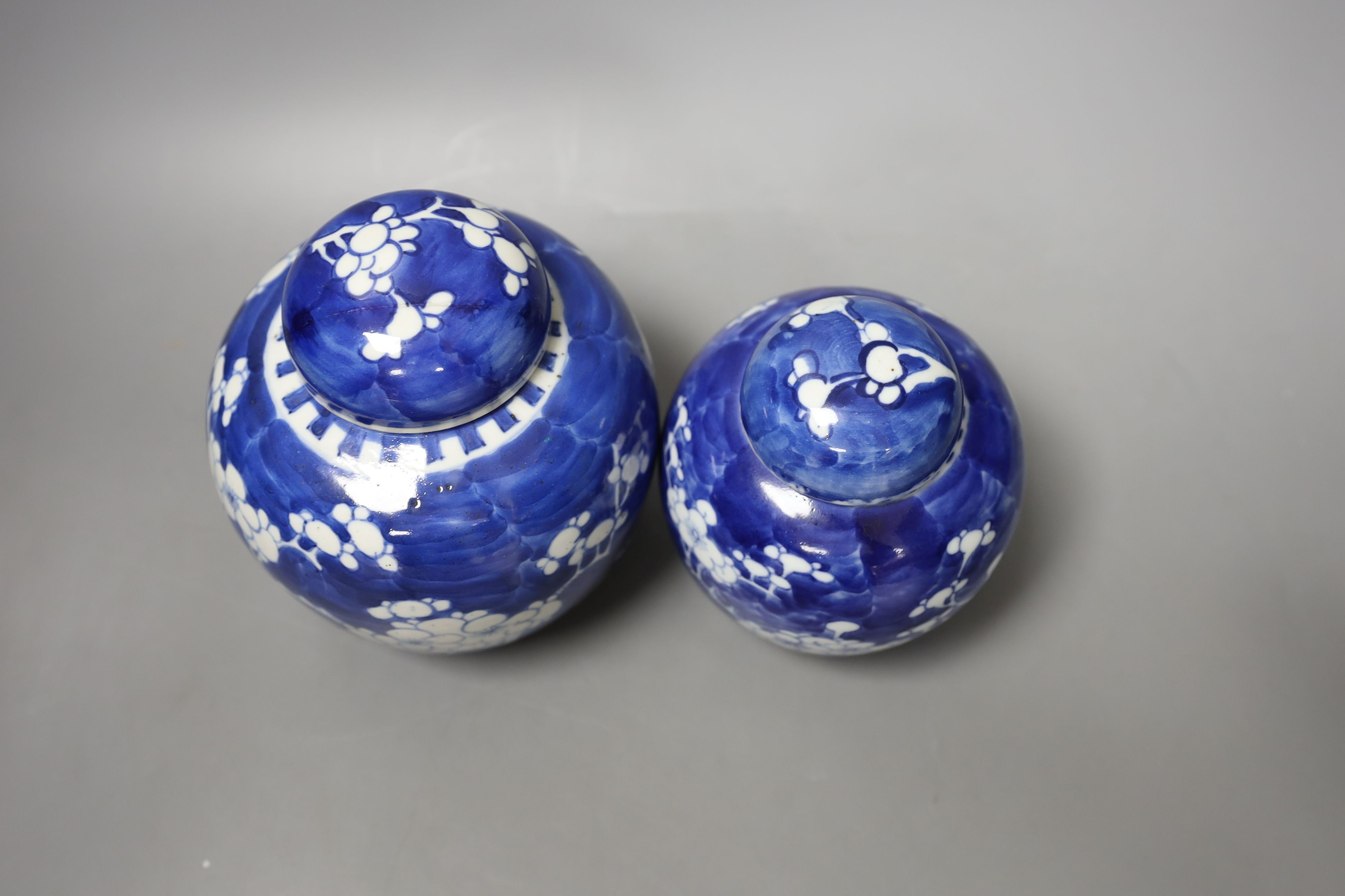 Three Chinese blue and white ginger jars and covers, a celadon plate and bamboo covered vase (5)